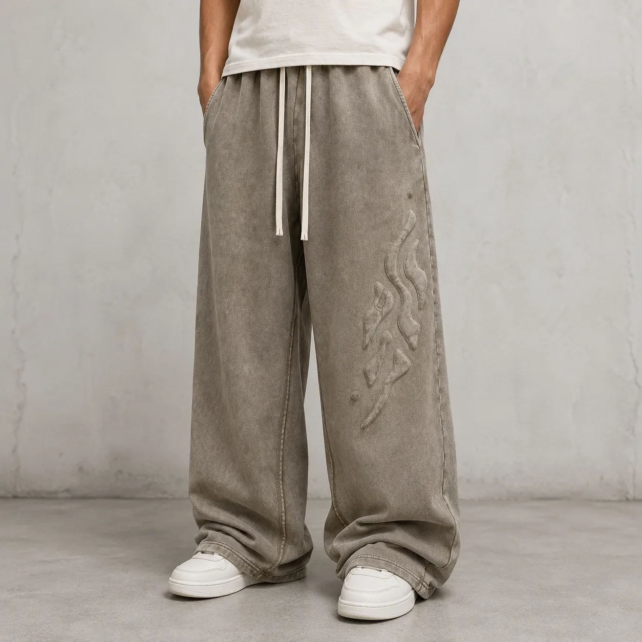 Model wearing coffee snow-washed 100% cotton terry wide-leg joggers