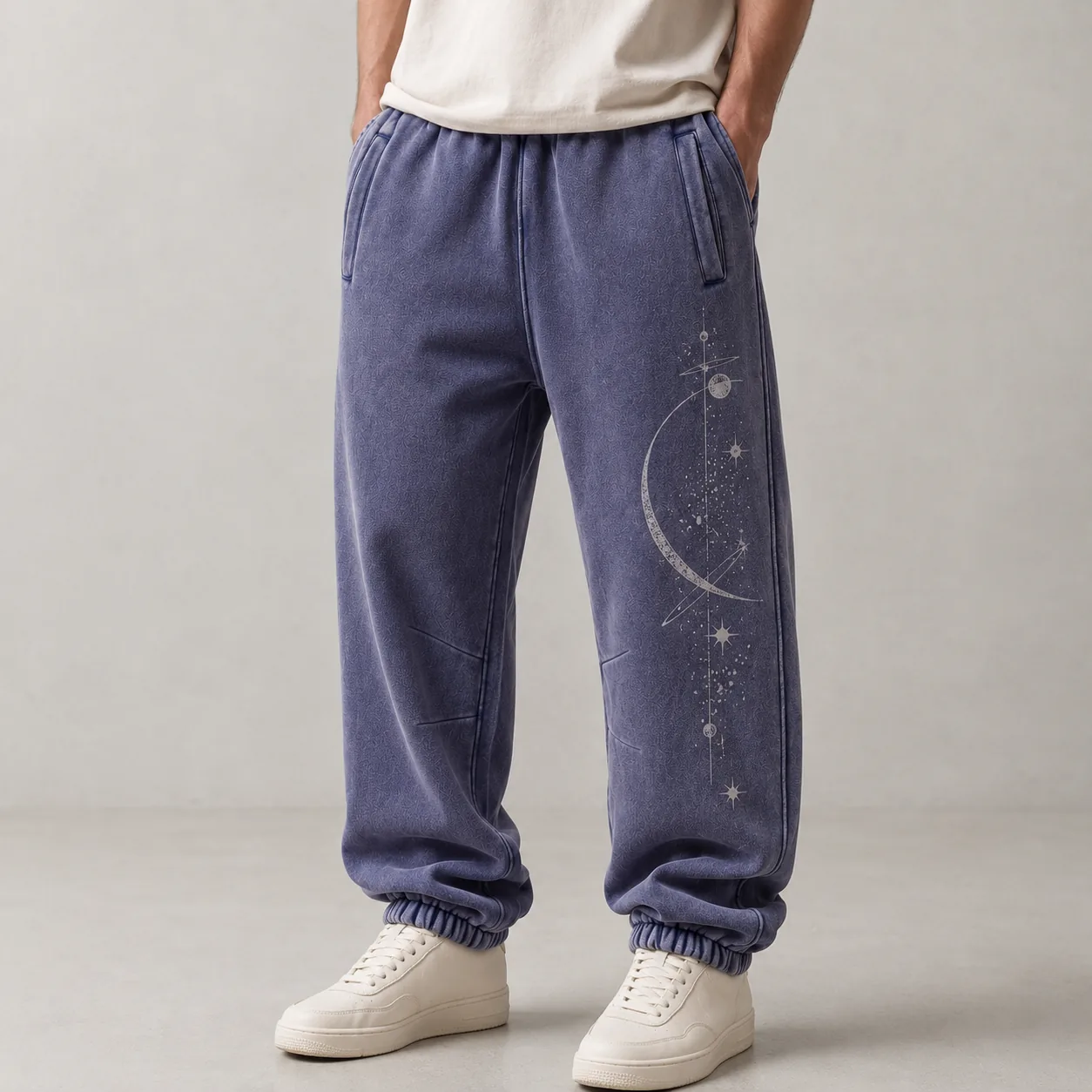 Model wearing purple 360GSM fleece-lined wax-dyed cotton-blend joggers