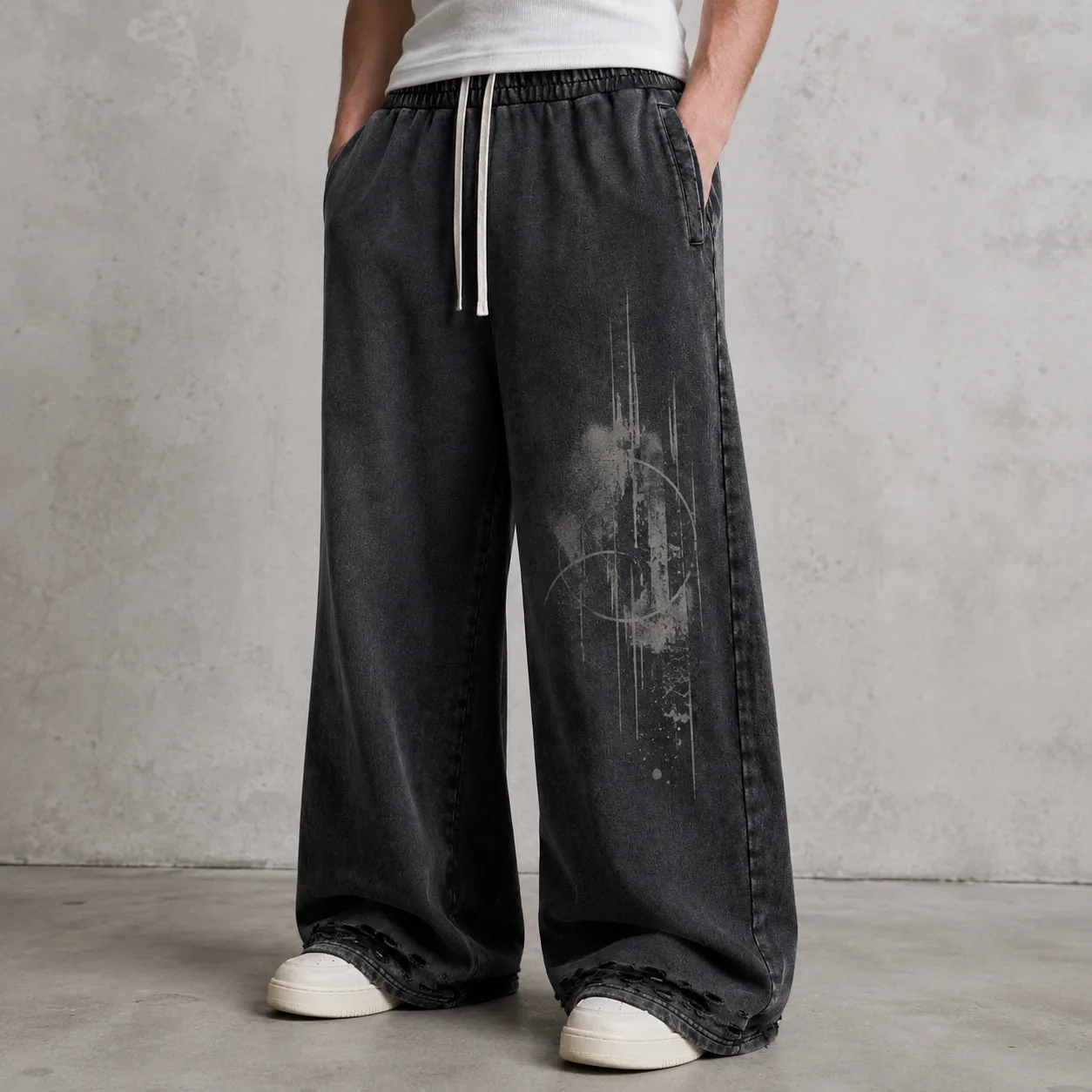 Model wearing black washed distressed 100% cotton wide-leg joggers