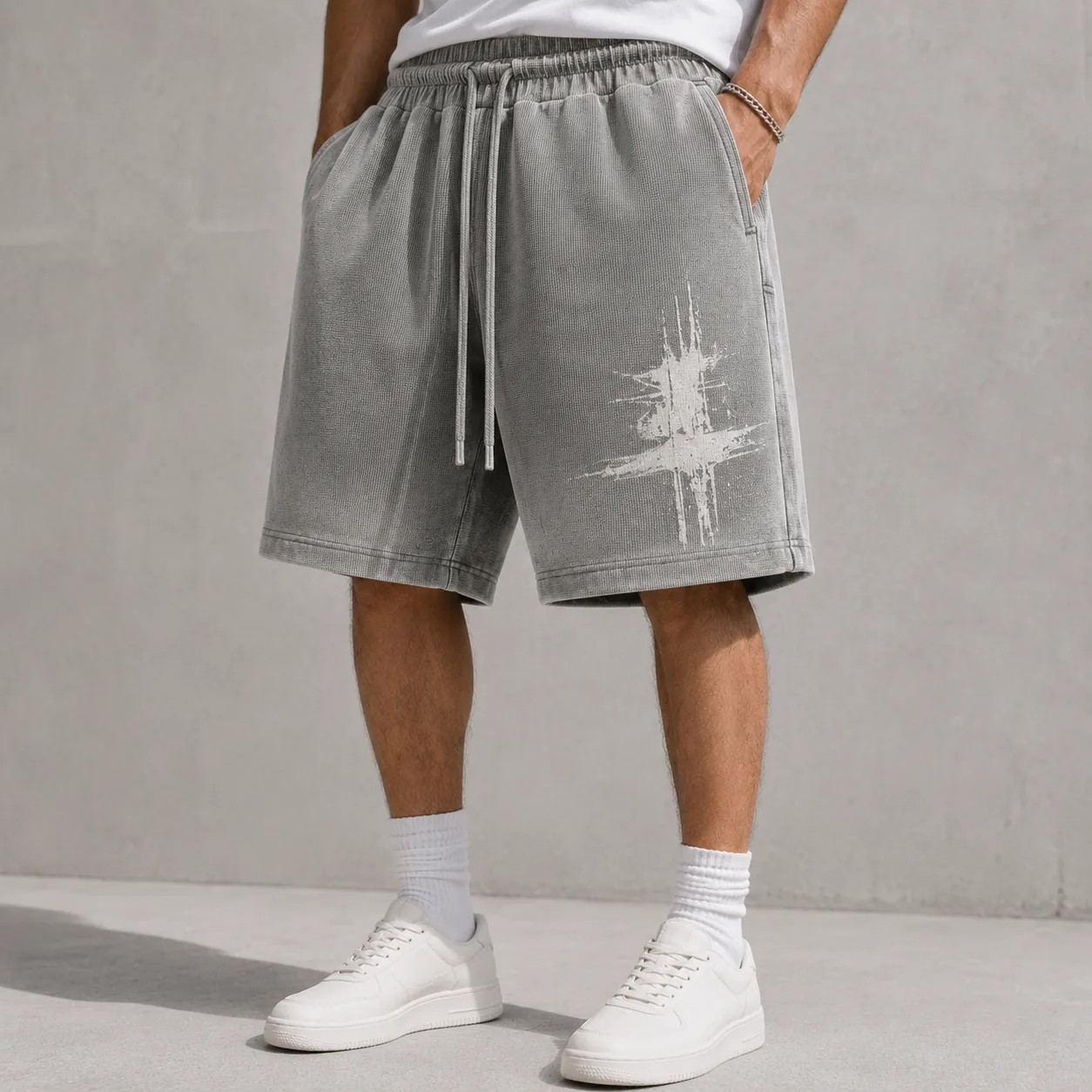 Grey snow-washed cotton-blend terry shorts with representative tonal graphic
