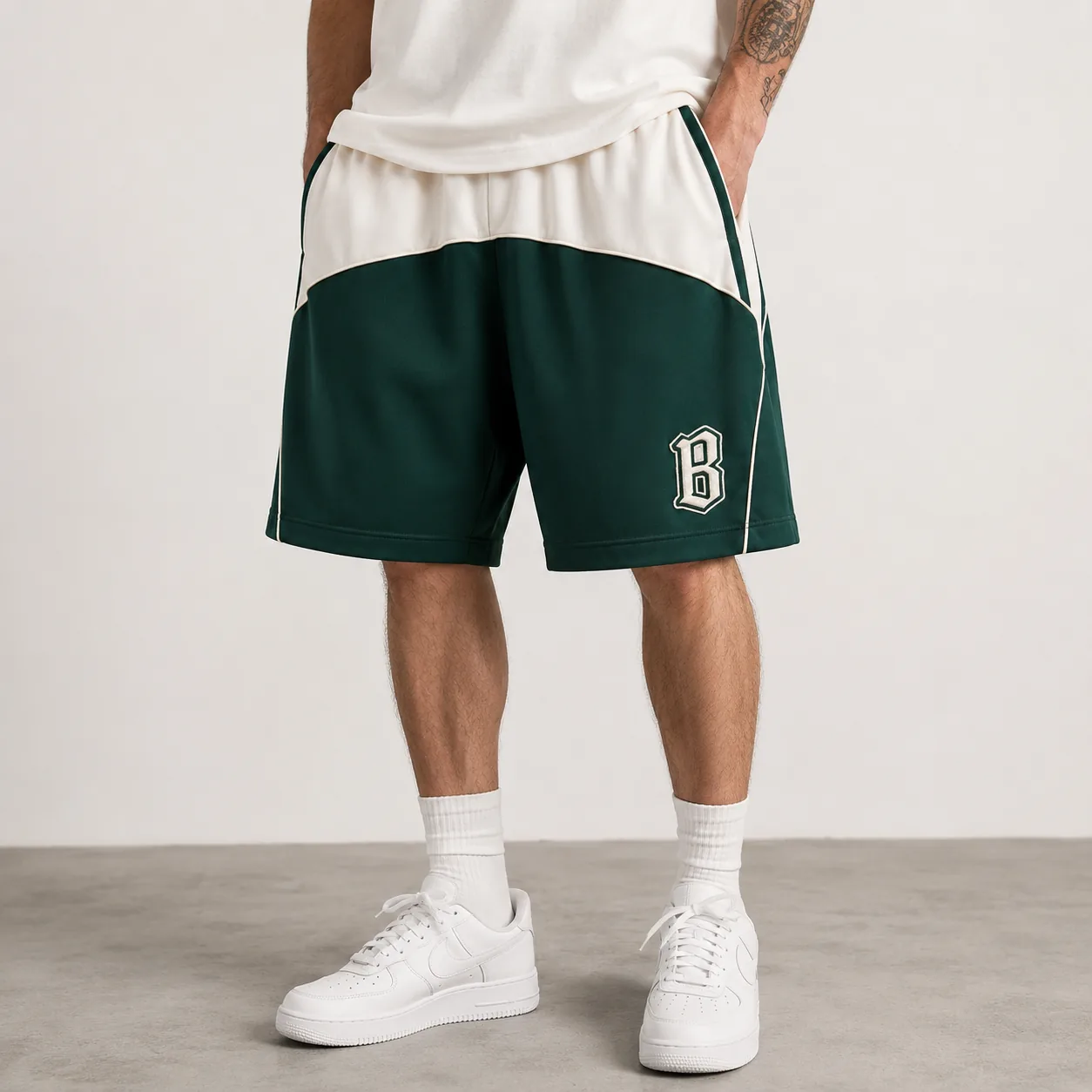 Green and ivory color-block cotton-blend loose-fit shorts with representative patch
