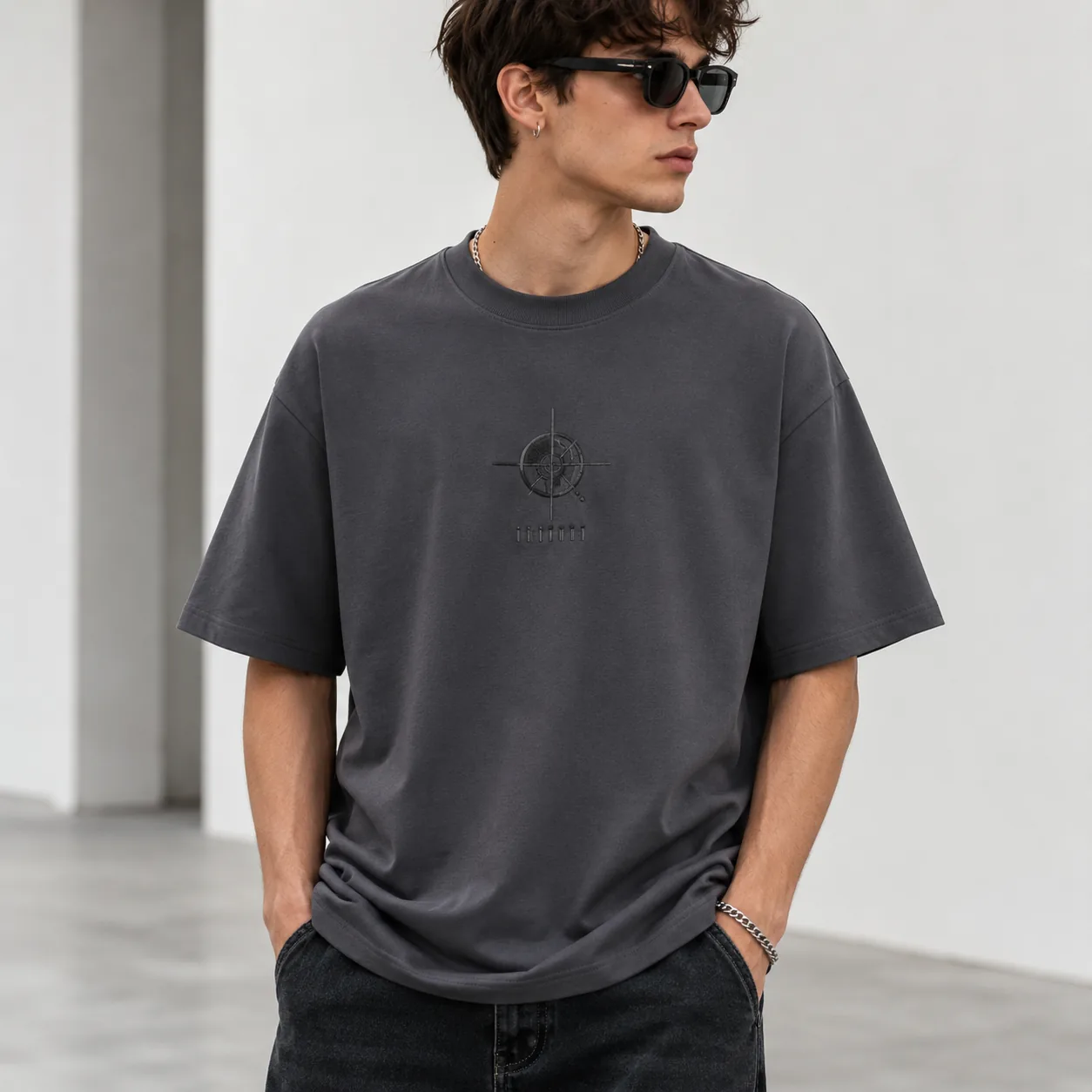 Man wearing charcoal custom cooling T-shirt with tone-on-tone chest embroidery